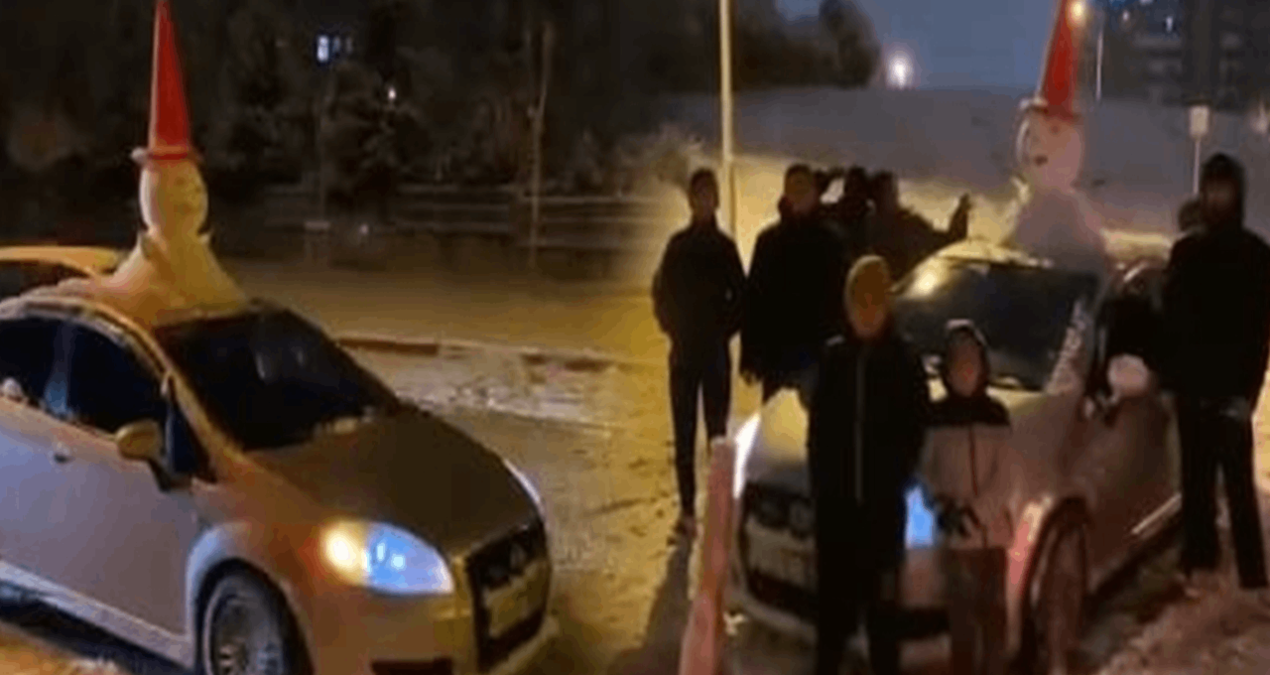 Arabasının üstündeki kardan adamla şehri turladı